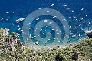 Boats on cristal water in capri, summertime photo