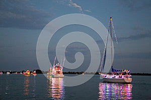 Power and Sailboats Participate in a Holida Boat Parade