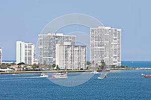 Boats Cruising Past Coastal Condos