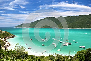 Boats in crystalline clear sea photo