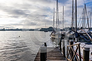 Boats and deck at the marina, Izabal Lake coast at the Caribbean sea, sky with white clouds, Sweet River, Puerto Barrios,