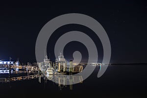 Boats docked along the waterfront in St Marys, Georgia at night