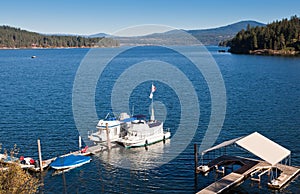 Boats Docked on a Blue Lake