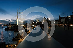 Boats docked at the harbor of Hamburg in the evening