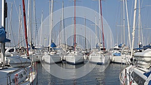 Boats docked at sailing sport club, racing yachts floating on water at marine