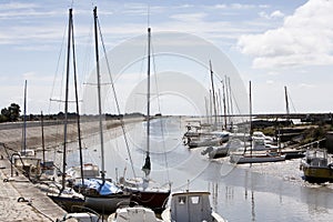 Boats falling dry at low tide in Noirmoutier photo