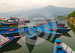 Boats and fery on water Lake Pheva