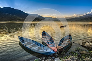 Boats on fewa lake in pokhara, nepal photo