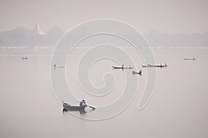 Boats with fishermen on the Taung Tha Man Lake