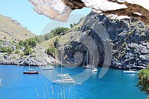 Boats floating on blue cristal clear sea