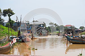 Boats in the floating village of Kompong Pluk photo