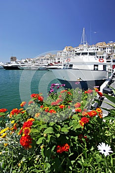 Boats and flowers in Puerto Banus Marina photo