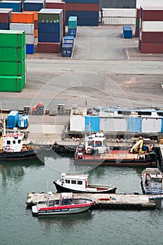 Boats and freight containers in cargo port