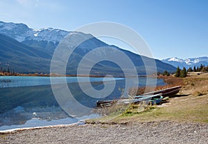 Boats in front of mountains and lake