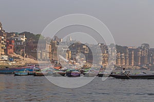 Boats on Ganges river at ghat in Varanasi city