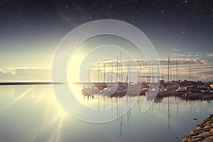 Boats in the harbor at dawn.