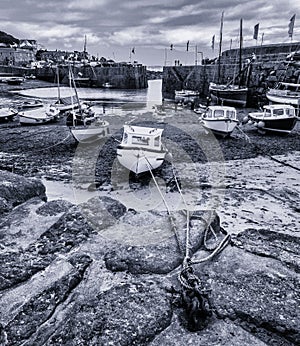 Boats in harbour at Mousehole,Cornwall at low tide