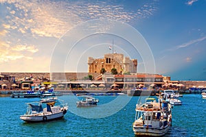 Boats in the harbour near famous Citadel of Qaitbay, Alexandria, Egypt