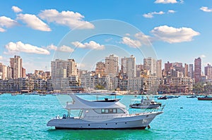 Boats in the harbour is the populated city district of Alexandria by the Mediterranean sea, Egypt