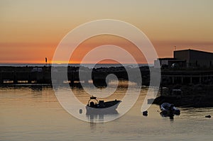 Boats in a harbour during sunset, Portugal. Summer landscape concept