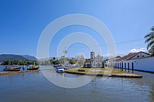 Boats and houses at the channel of the historic town Paraty, Rio de Janeiro state, Brazil