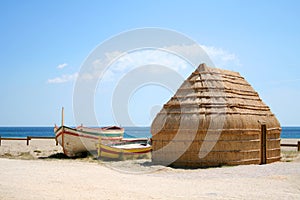 Boats and hut on beach, Port Barcares, France