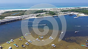 Boats, kayaking, swimming activities on Crab Island near Santa Rosa Island white sandy beach along Gulf of Mexico near Okaloosa