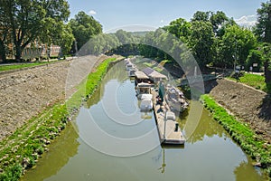 The boats on Kis Duna waterchannel in Eszstergom photo