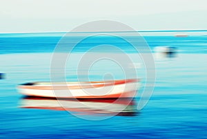 Boats on lake and the horizon, motion blur