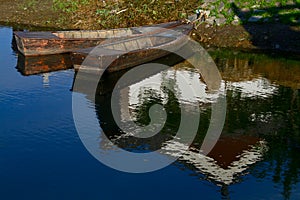 Boats in the lake with reflection of a building in water