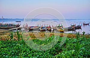 The boats on lake`s bank, Amarapura, Myanmar