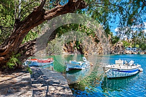 Boats on Lake Voulismeni. Agios Nikolaos, Crete photo