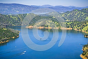 Boats after leaving Pleasure cove in south Berryessa lake from Stebbins Cold Canyon, Napa Valley, California photo