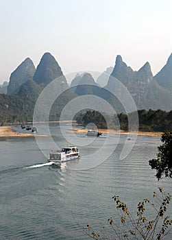 Boats on the Li River between Guilin and Yangshuo in Guangxi Province, China