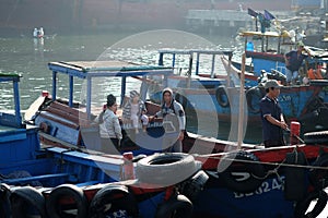 Boats and Lifestyle at Qui Nhon Fish Port, Vietnam in the morning.