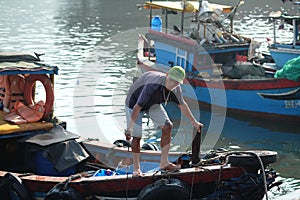 Boats and Lifestyle at Qui Nhon Fish Port, Vietnam in the morning.