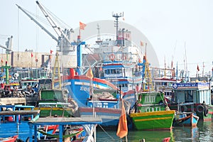 Boats and Lifestyle at Qui Nhon Fish Port, Vietnam in the morning.