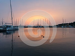 Boats, marina at dawn, sunrise clouds,Thessaloniki Greece