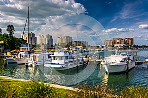 Boats in a marina and hotels along the Intracoastal Waterway in photo