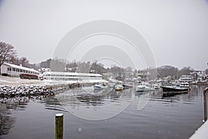 Boats in marina at Perkins Cove Harbor in Oginquit Maine during winter
