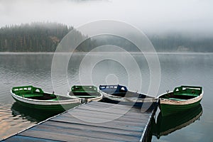 Boats on misty morning