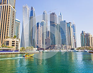 Boats and modern buildings in Dubai Marina