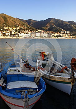 Boats moored in Cefalu harbor