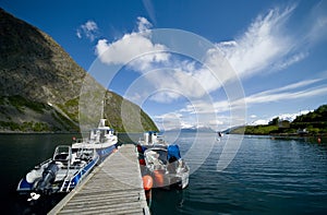 Boats moored in Fjord