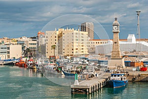 Boats moored in the harbor at Marina, Port Vell in Barcelona, Spain.