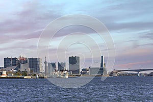 Boats moored at Harumi Passenger Terminal on Tokyo Bay with Ariake island.