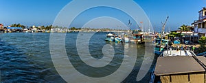 Boats moored in the lagoon in Negombo, Sri Lanka after returning from an early morning fishing trip