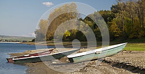 Boats moored on lake