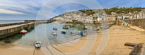 Boats moored in Mousehole harbour, Cornwall