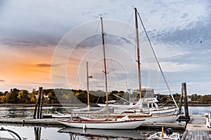 Boats moored near the dock at sunset. Maine, USA.